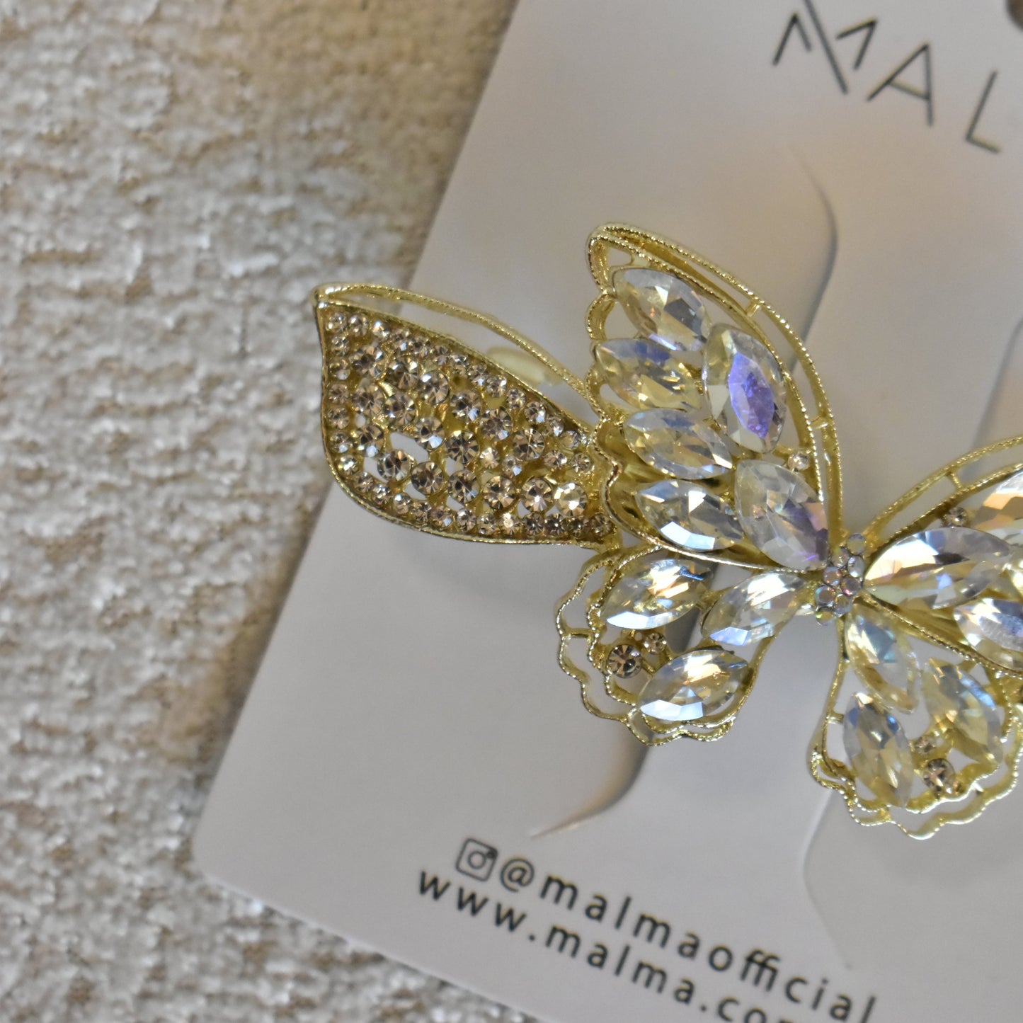 Clip dorado mariposa